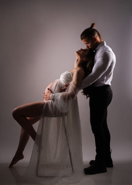 Artistic Maternity Couple Portrait with Dramatic Posing