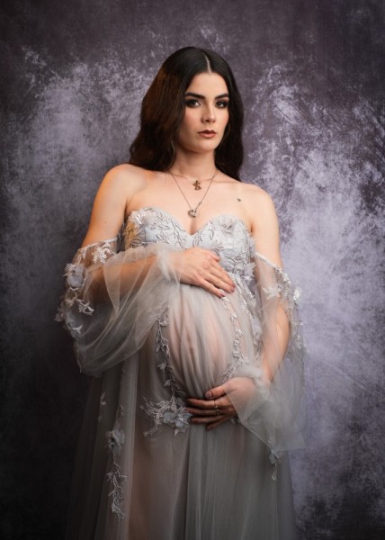 Elegant Maternity Portrait with Textured Backdrop