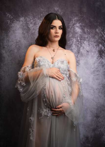 Elegant Maternity Portrait with Textured Backdrop